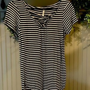 Black and white striped shirt with a cross cut